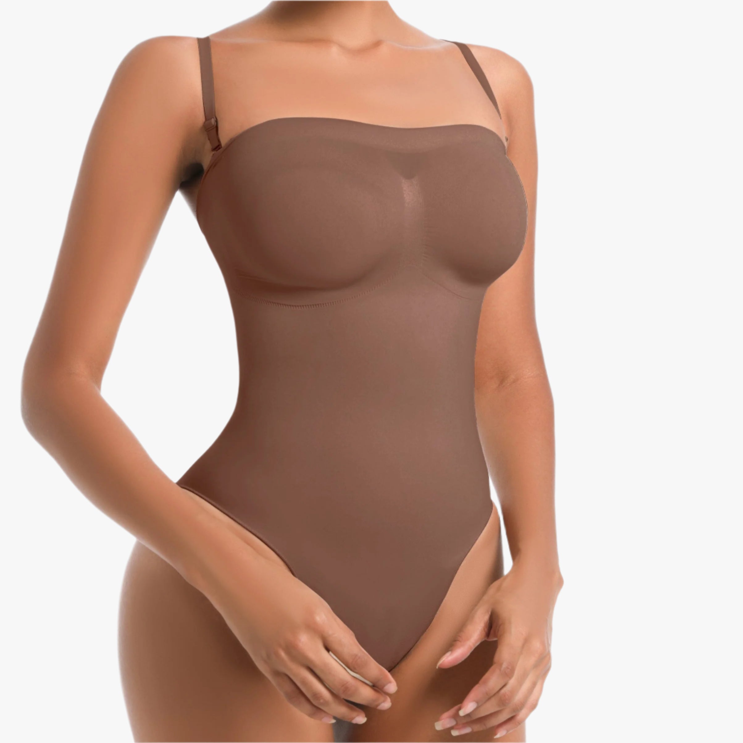 Woman wearing a brown bodysuit on a white background
