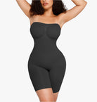 Black shapewear garment worn by a model on a white background
